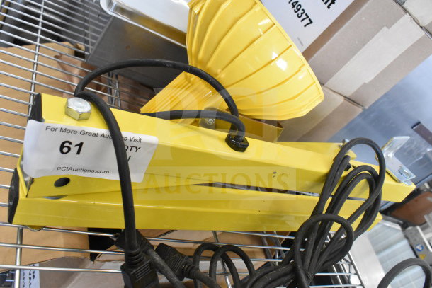 Brand new Rite Hite RH-40-P loading dock light, yellow, with minor scratches, includes mounting hardware and power cord.