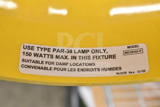 BRAND NEW Rite Hite RH-40-P loading dock light, yellow. Label specifies use of PAR-38 lamp, 150 Watts max, suitable for damp locations. Model: INCHEAD-P.