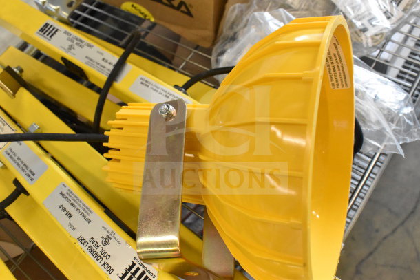 Brand new Rite Hite RH-40-P loading dock light, yellow with adjustable arm, minor scratches, labels intact.