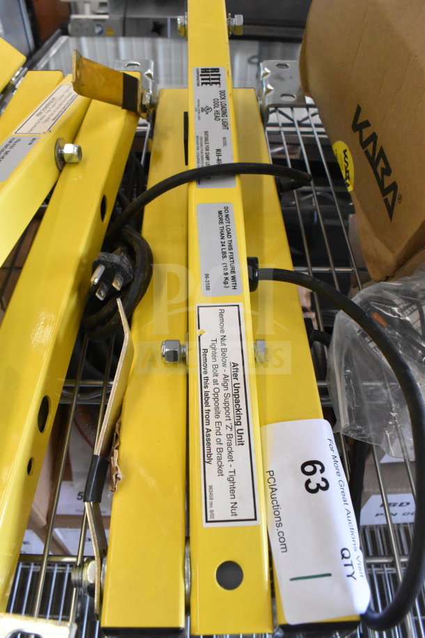 Brand new Rite Hite RH-40-P loading dock light, yellow, with power cord; has "Do Not Load" label and assembly instructions.