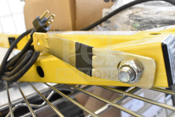 BRAND NEW with minor scratches, Rite Hite RH-40-P Loading Dock Light, yellow, with attached power cord, visible mounting hardware.