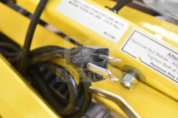 BRAND NEW Rite Hite RH-40-P loading dock light, visible plug, slight scratches and dents, yellow finish, factory labels.