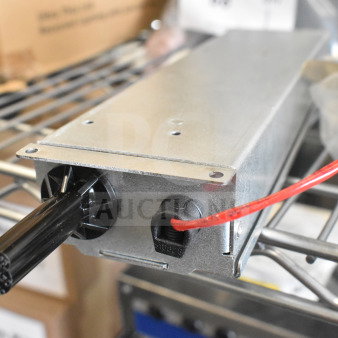 Flos E347601 light fixture, metal housing, exposed wires, good condition, ideal for industrial applications.