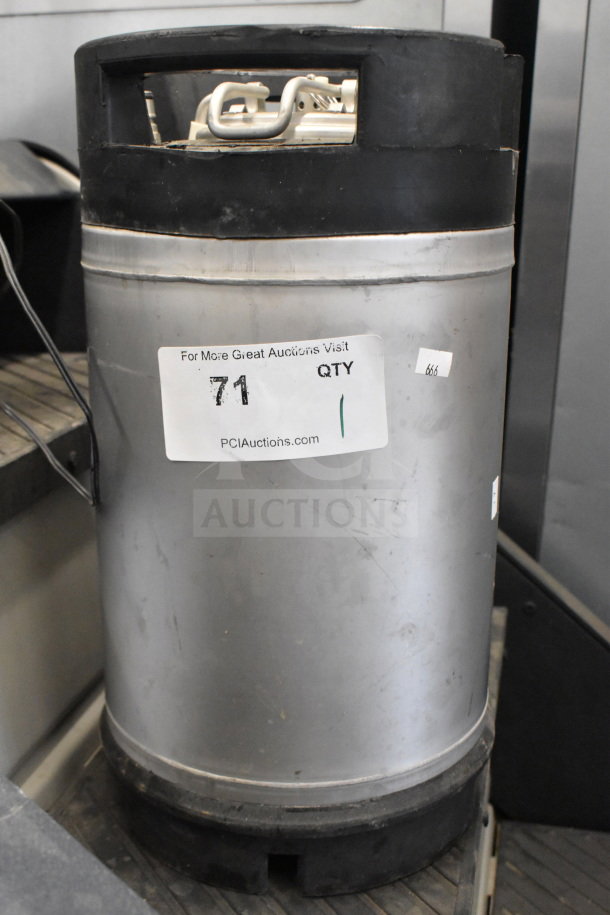Stainless steel K1109(2) keg with black rubber handles and base. Visible label reads "71" and "PCIAuctions.com". Used condition.