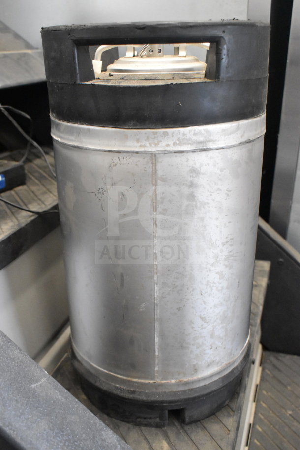 Stainless steel keg model K1109(2), with black handles and base, visible wear. Ideal for brewing or commercial use.