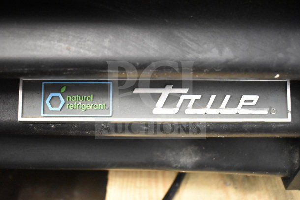 2021 True TVM-48SL-HC cooler label, highlighting "natural refrigerant" and True logo.