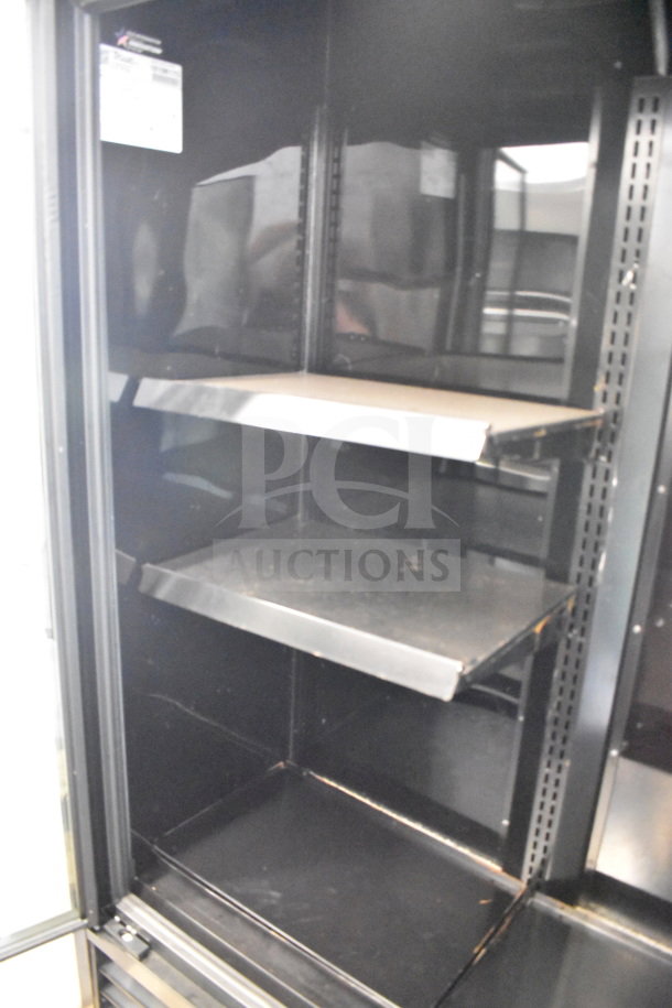 2021 True TVM-48SL-HC commercial 2-door cooler, black interior, adjustable shelves, energy-efficient, visible label.