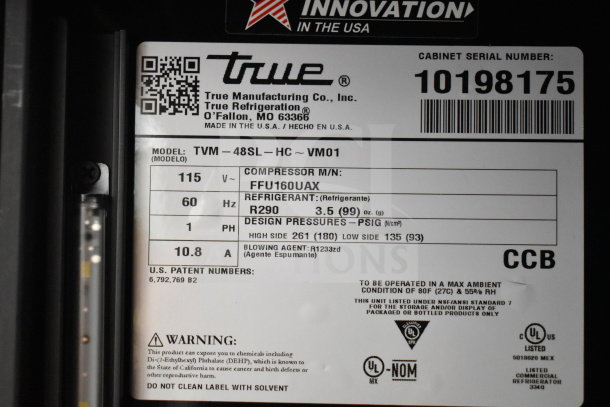 Label of 2021 True TVM-48SL-HC cooler, 115V, 1 Phase, model details, compressor and refrigerant info displayed. Made in USA.