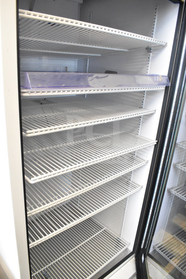 2021 True TSCI-600R-G-PH Commercial Single Door Cooler, glass door, multiple shelves, excellent condition. 115V, 1 Phase.