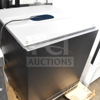 Brand new Follett ID50 commercial ice machine head, scratch and dent condition, black exterior, resting on a pallet.