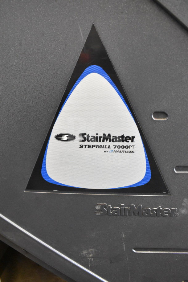 Nautilus StairMaster Stepmill 7000PT exercise machine label, features brand and model name, good condition.