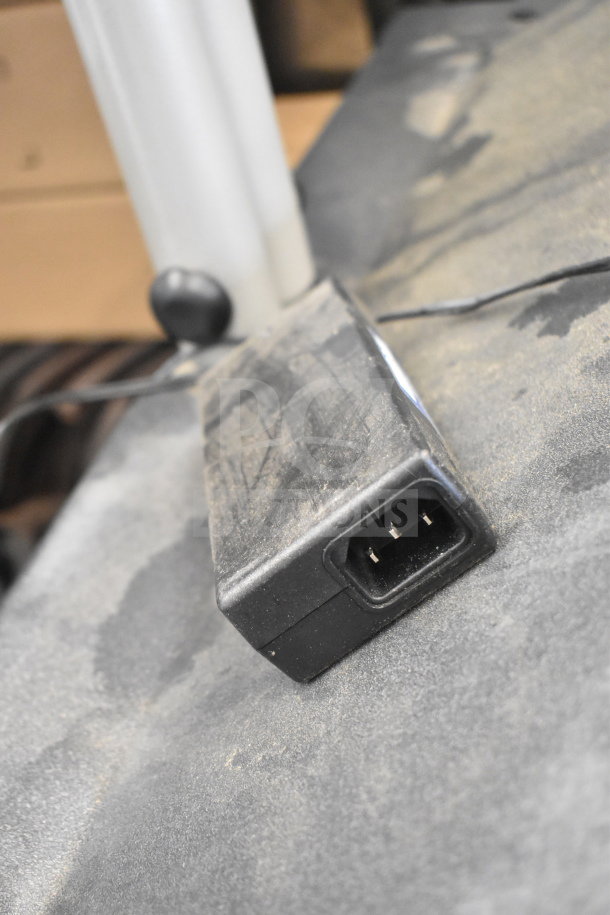 Nautilus StairMaster Stepmill 7000PT plug detail on exercise machine showing power connection with some dust.