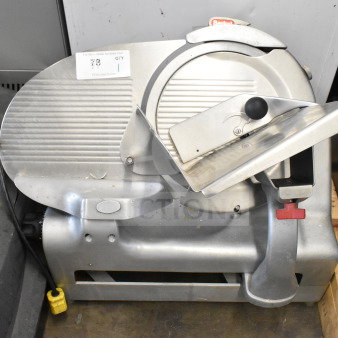 Berkel commercial countertop meat slicer with sharpening blade, 115 volts, 1 phase. Good condition with visible power cord.