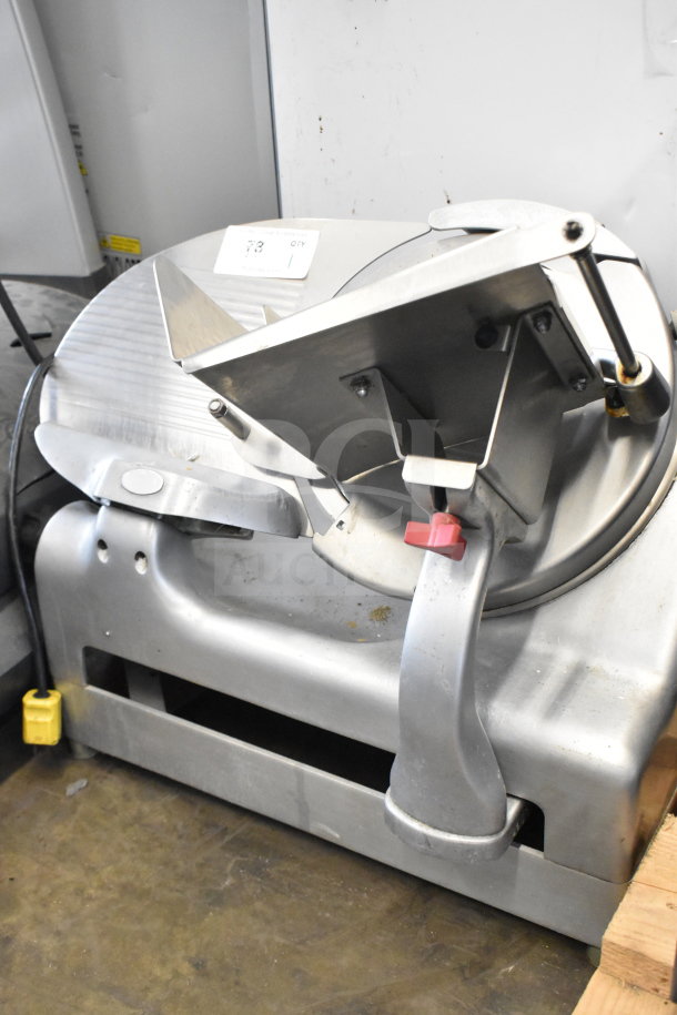 Berkel commercial countertop meat slicer with sharpening blade, 115V, 1 phase. Features sturdy metal construction, good condition.