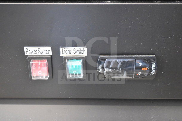 "Avantco 178GDC49FHCB freezer control panel with labeled power and light switches, clear protective cover, LED lighting indicator."