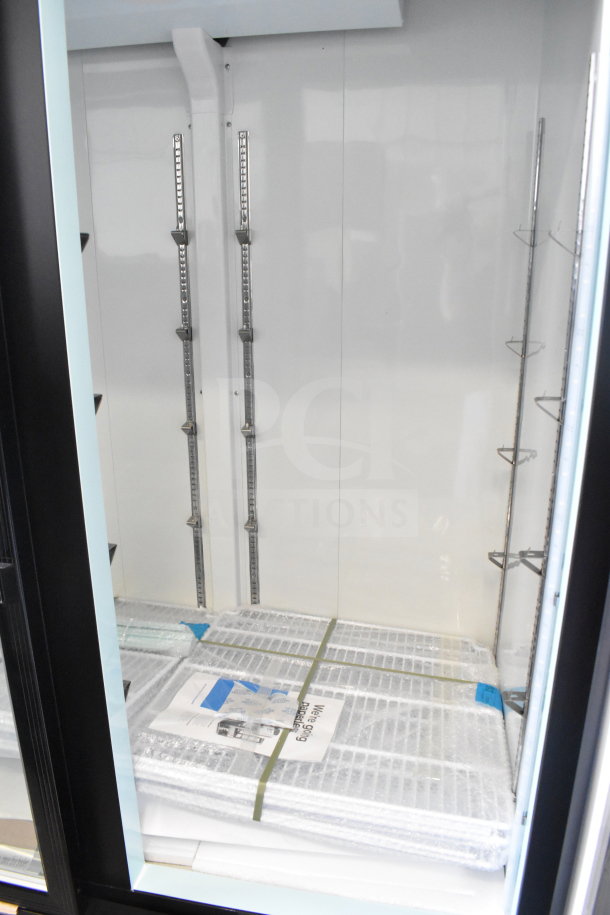 Brand new Avantco 178GDC49FHCB commercial black swing glass door freezer with LED lighting, scratch and dent condition, 115V.