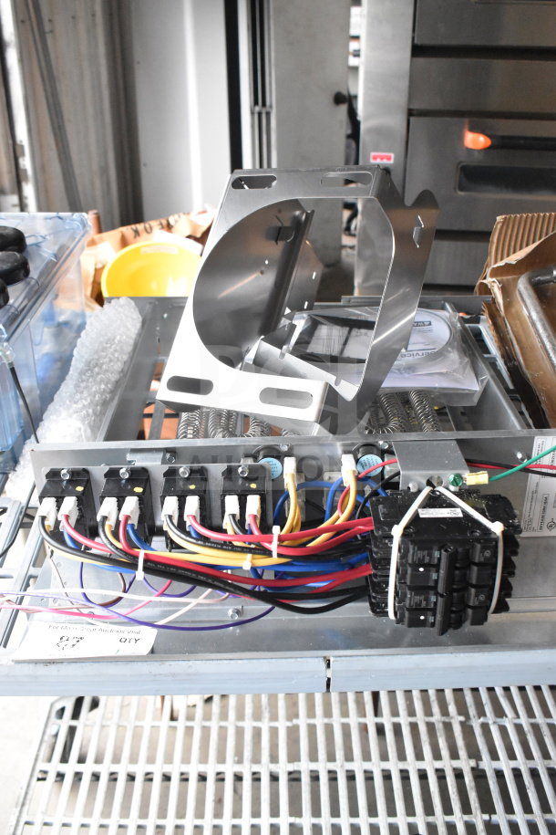 BAYEABC20BK1BAA supplementary electric heater unit, new condition, visible wiring and breaker, includes mounting bracket.