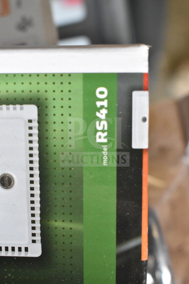 Box corner of Surveyor Air Temperature Sensor, model RS410, new condition with visible packaging design.