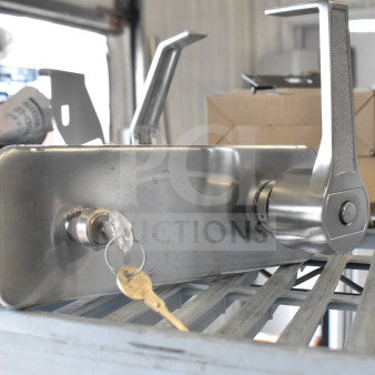 Stainless steel door handles with keys, mounted on a metal plate. New condition, includes two handles.