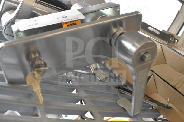 Stainless steel 2 door handle set with keys, rectangular backplate, and visible screws; "Qty 2x" label indicates auction lot.