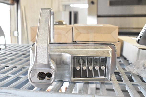 Chrome 2 door handles with locking mechanism. Features numbered dials for combination locks. New condition.