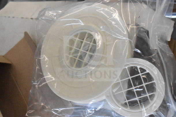4 Navien exhaust plunges in new condition, sealed in plastic bag. White plastic with grid design, ready for installation.