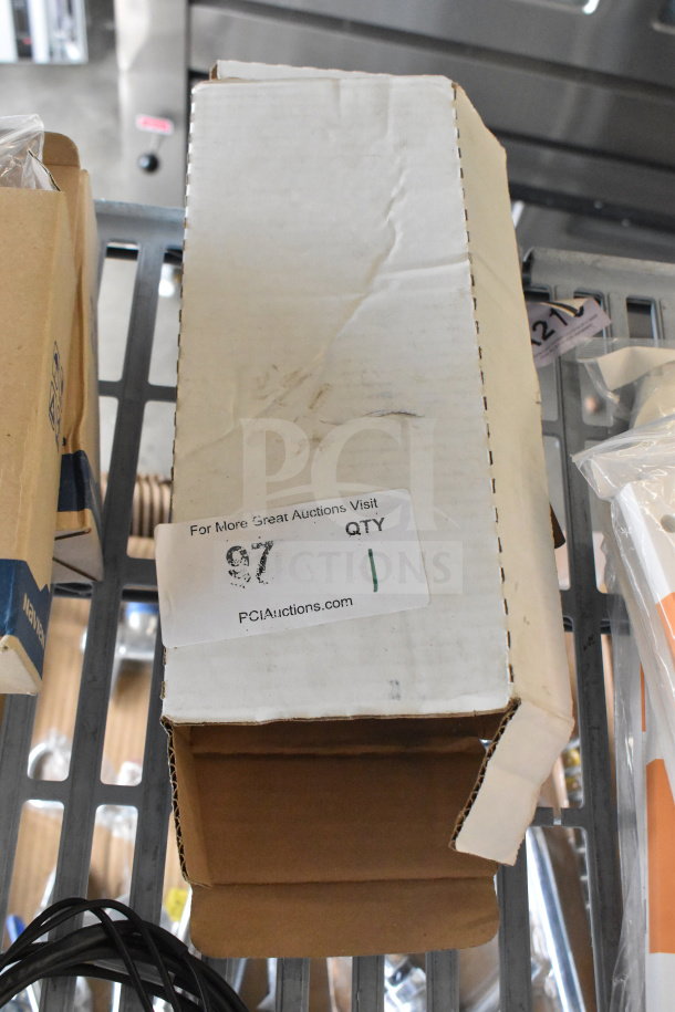 Resideo L6006C Aquastat box, white exterior, auction label from PCIAuctions.com, condition visible but unclear.