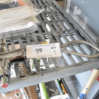 Chrome faucet handle with dual levers and braided hose, excellent condition, tagged as auction item 98 on metal shelf.