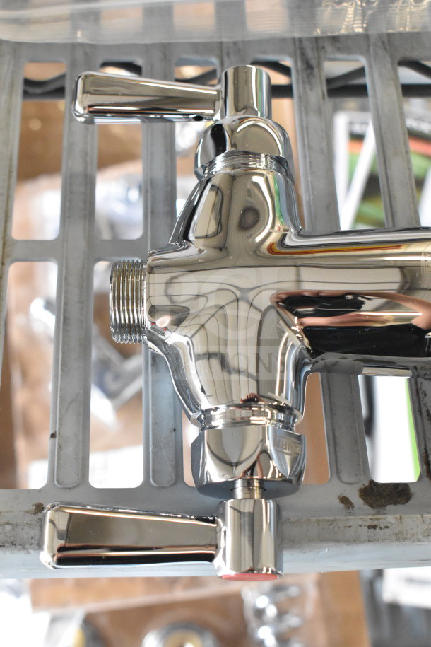 Chrome-finished metal faucet handles with dual levers, new condition, featuring standard threaded connections.