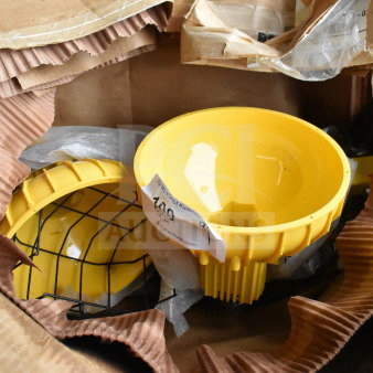 Yellow RP-H-40-P Dock Loading Light in original packaging with protective metal wire guard; labeled for auction.