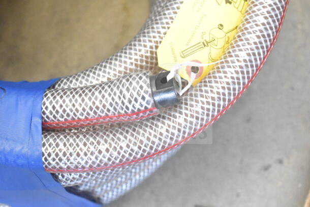 Auction item: Insulated hose with cable, includes visible yellow instruction tag, blue wrap. Good condition.