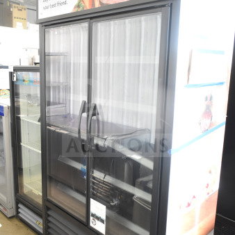 2021 True TVM-48SL-HC commercial 2-door reach-in cooler. Features glass doors, internal shelving, 115V, 1 phase.