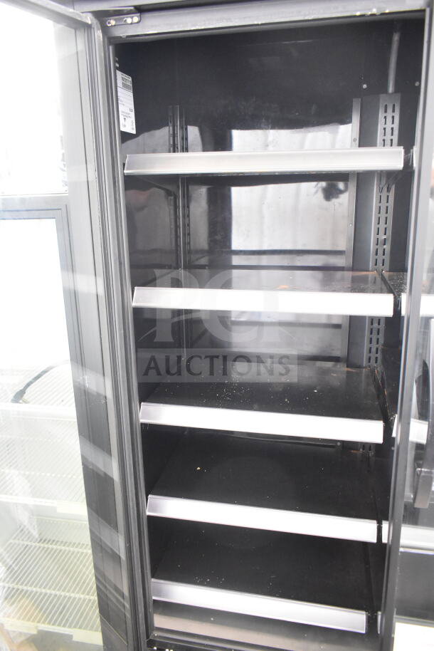 2021 True TVM-48SL-HC Commercial Cooler, 2-door, black interior, shelves visible. 115 volts, 1 phase.