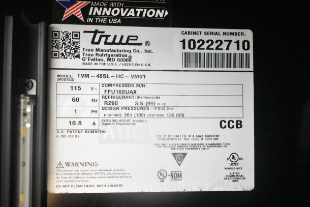 "Label of 2021 True TVM-48SL-HC Commercial Cooler Merchandiser, 115V, 1 Phase, model details and caution warning visible."