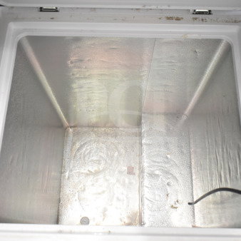Hisense WFC050M6XWD chest freezer interior, 115 volts, 1 phase, showing spacious storage with some wear.