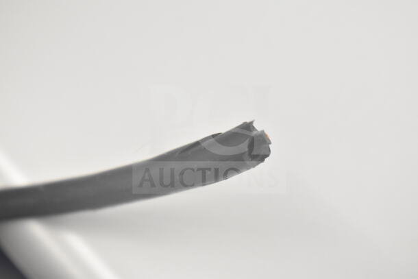 Damaged power cord of Hisense WFC050M6XWD Chest Freezer, 115 Volts, 1 Phase, showing cut insulation and exposed wires.