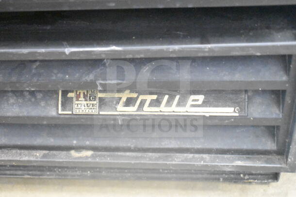 True GDM-12 commercial cooler label, showing brand logo and manufacturing company details.