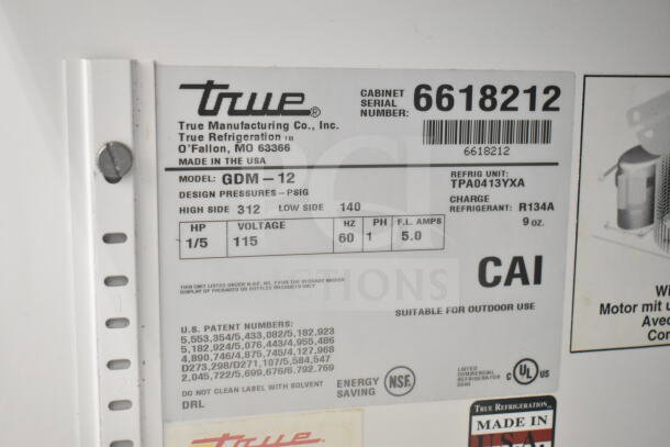 Label on True GDM-12 Commercial Cooler. Model GDM-12, 115V, Phase 1, Refrigerant R134A, Made in USA. Serial 6618212.
