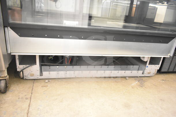 Structural Concepts NR6051RRSV.8106 deli display case, commercial floor style, 120V, 1 phase, silver finish, underside view.