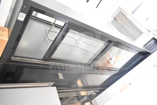 Structural Concepts NR6051RRSV.8106 deli display case in good condition, glass front, black frame, 120V, 1 Phase.