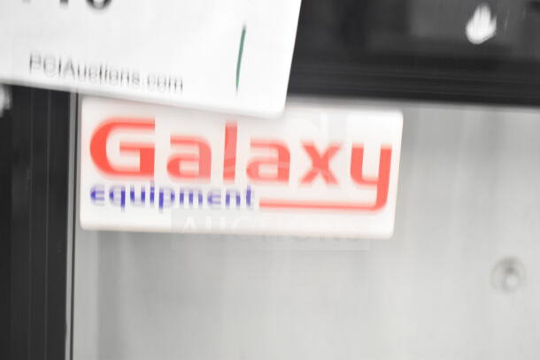 Galaxy merchandiser door with logo, used condition, includes original branding label, ideal for commercial display.