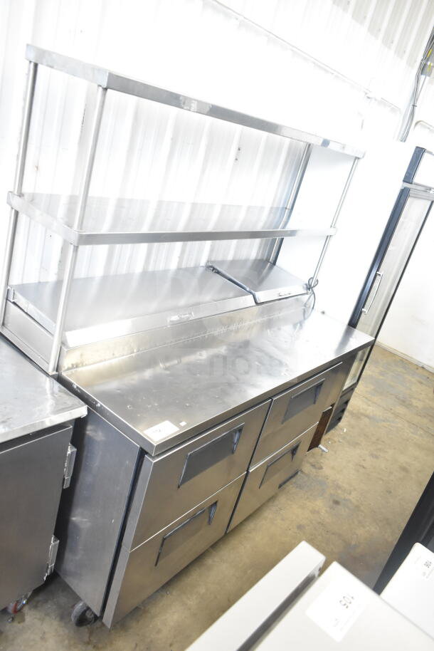 True TPP-67D-4 commercial pizza prep table with 4 drawers, 2-tier overshelf, and commercial casters. 115V, 1 phase.