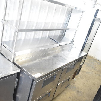 True TPP-67D-4 commercial pizza prep table with 4 drawers, 2-tier overshelf, and commercial casters. 115V, 1 phase.