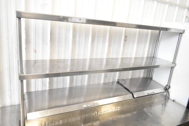 True TPP-67D-4 commercial pizza prep table with four drawers, two-tier over shelf, and commercial casters. 115V, 1 Phase.