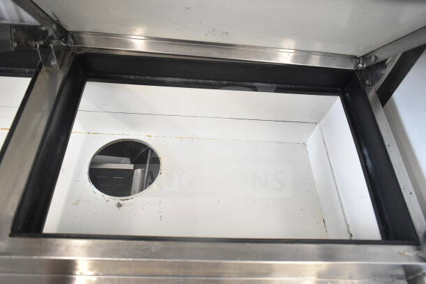 True TPP-67D-4 pizza prep table interior, featuring stainless steel construction and drawer compartment.