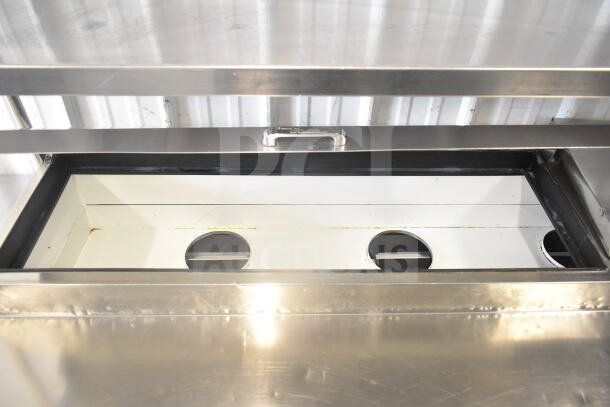True TPP-67D-4 pizza prep table with 4 drawers, 2-tier overshelf, commercial casters; 115 Volts, 1 Phase. Stainless steel.