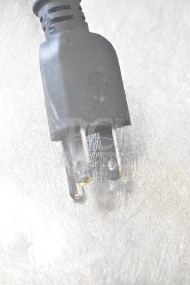 Power cord plug for CoolTech CUST-60LB undercounter cooler, 115 volts, pictured against metallic surface.