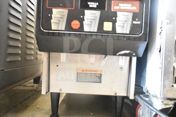 Bunn FMD DBC-3 commercial cappuccino machine with user controls. Warning label on base. 120/240V, 1 phase.
