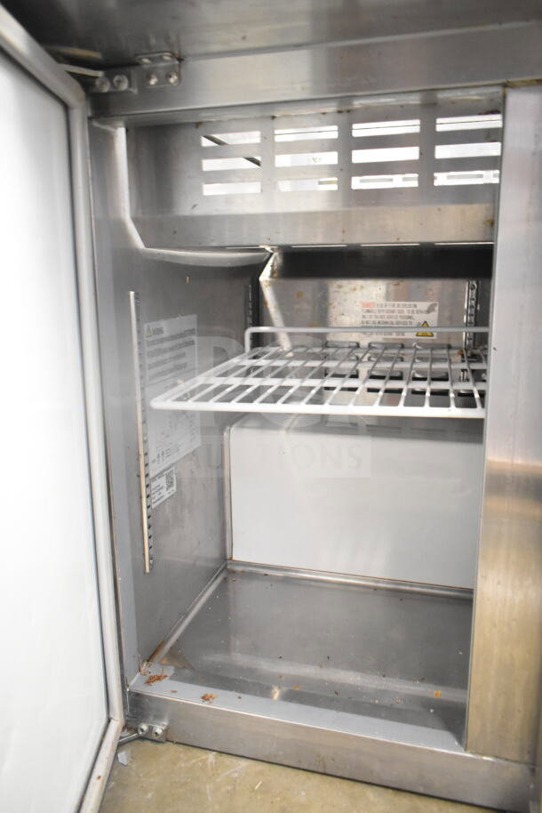2022 Coldline SMP-36 sandwich prep table, missing back lid part. Features metal shelving and interior label. 115V, 1 phase.