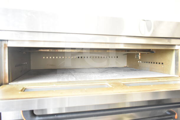 Lusi YCO-4-16D commercial propane gas 4 deck bakery oven, stainless steel, spacious interior, slight wear visible.